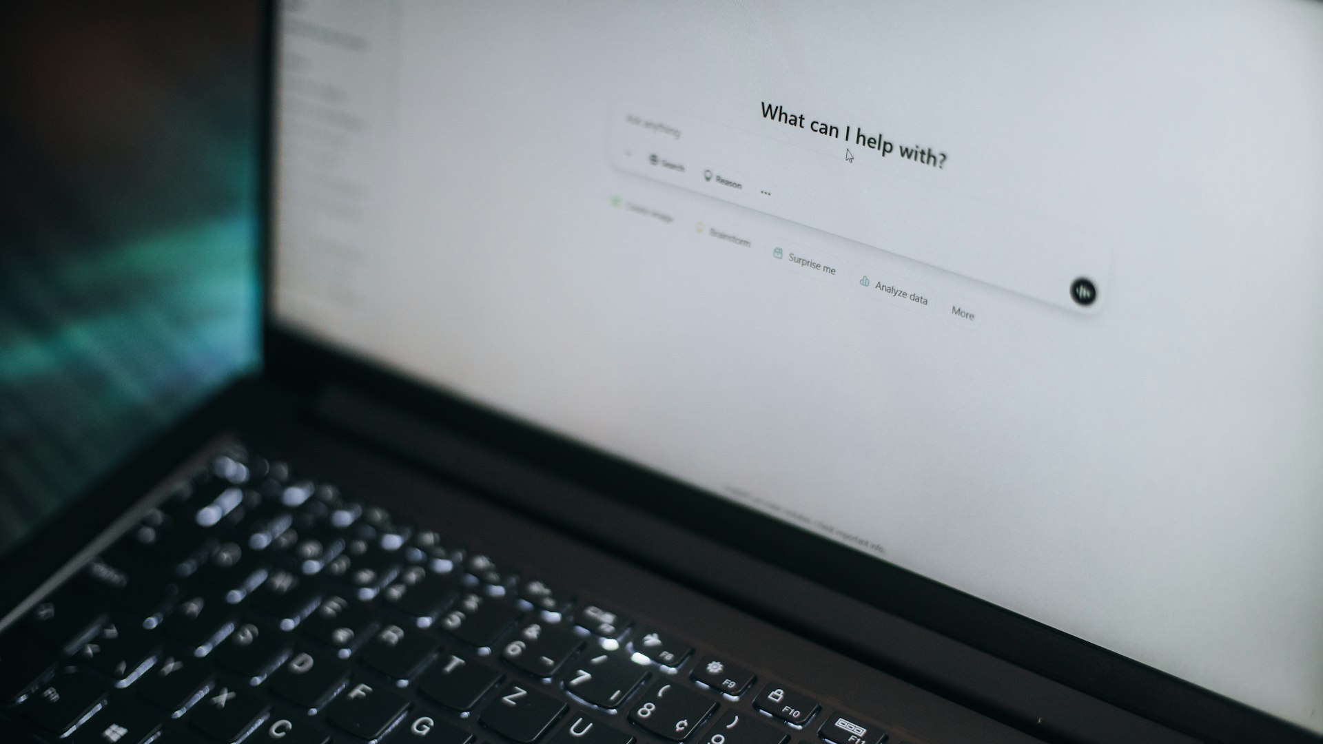 A laptop screen showing an AI assistant prompt