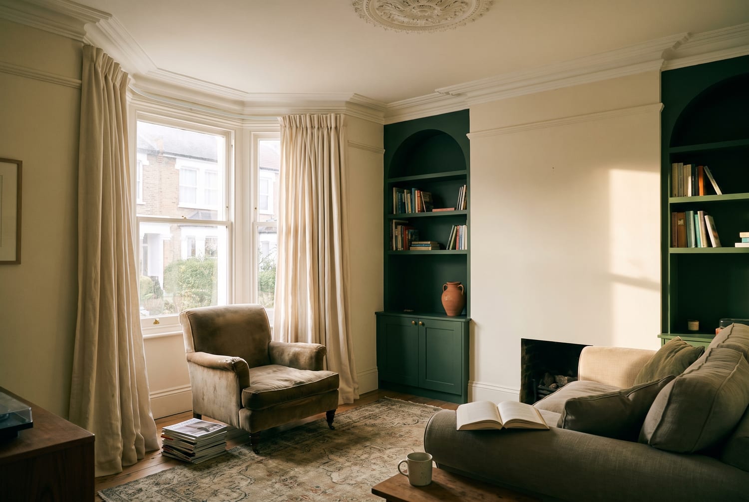 A finished living room with a feature fireplace